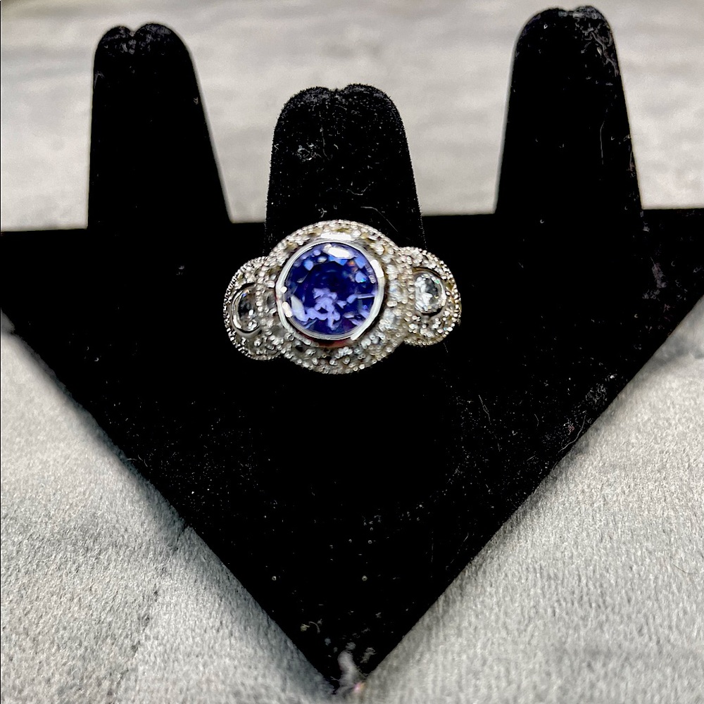 Round Purple stone with pillows of simulated diamonds .925 Sterling silver